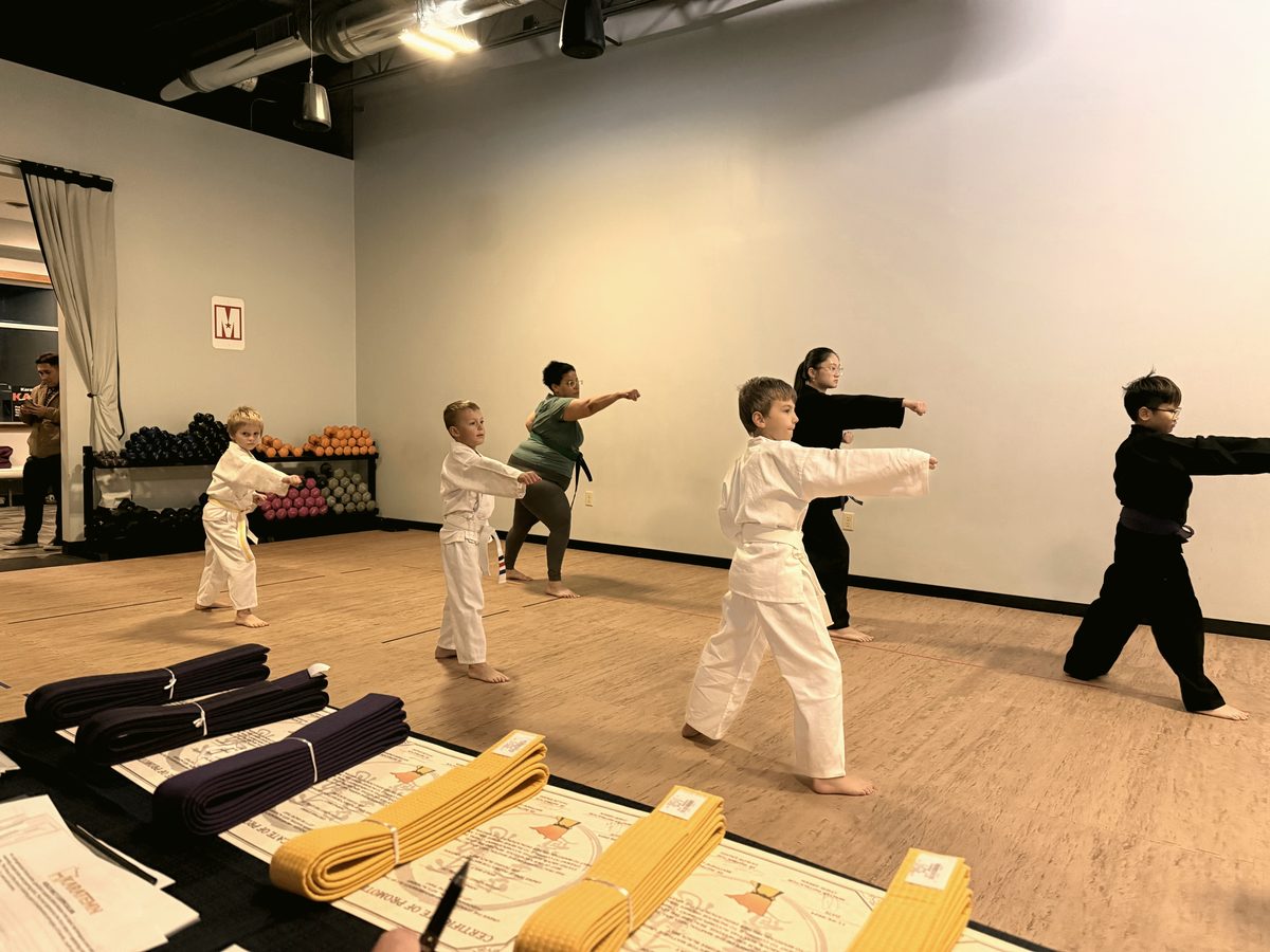 Students practicing punches during a martial arts class